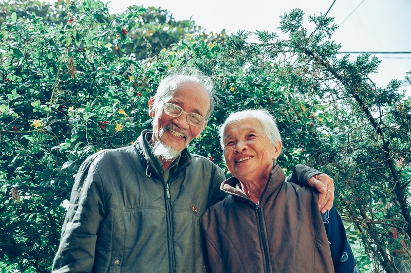 photo of two seniors at a park