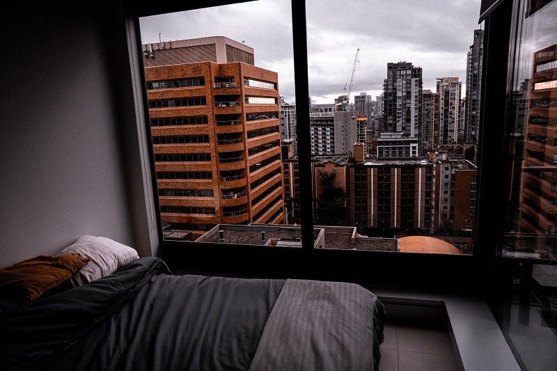 stock photo of a bedroom overlooking a city
