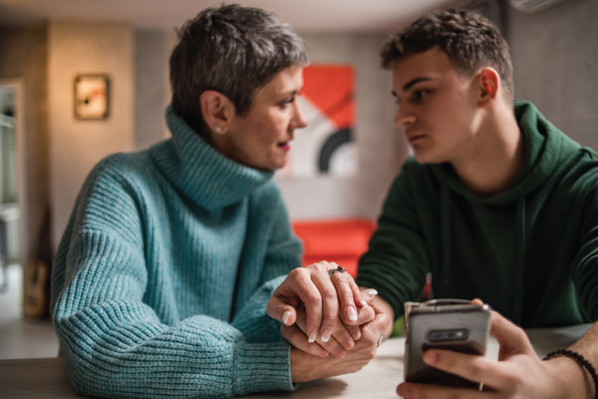 stock image of mother and son talking
