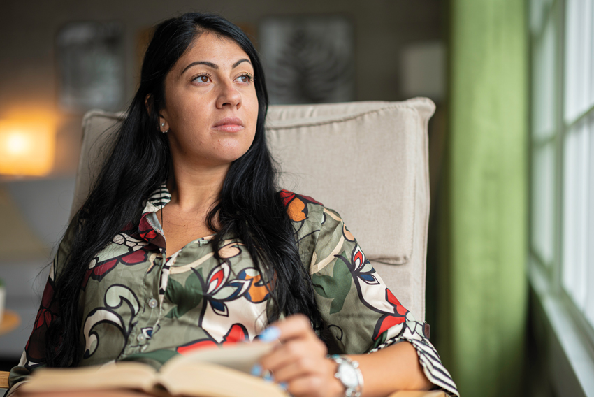 stock photo of a woman sitting in a chair