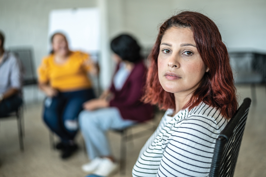 Stock photo of young woman in a group session