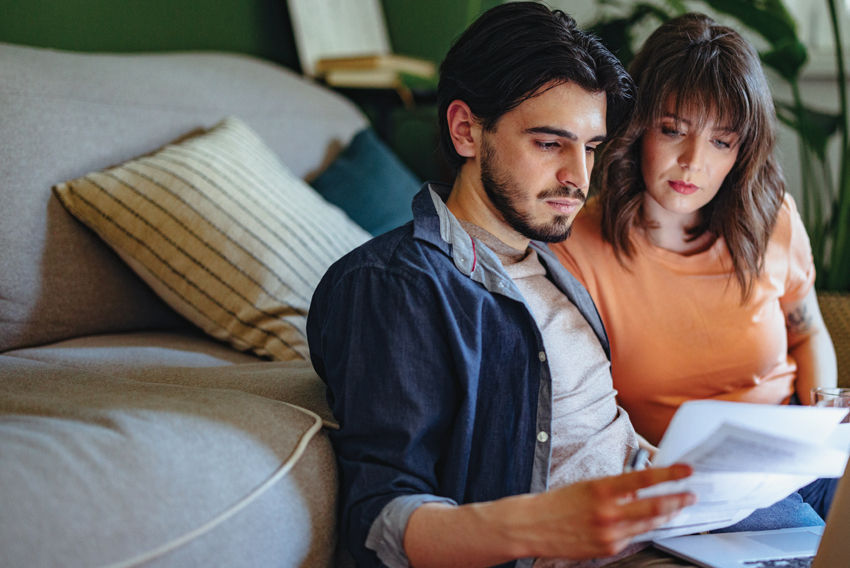photo of a man and woman looking at paperwork