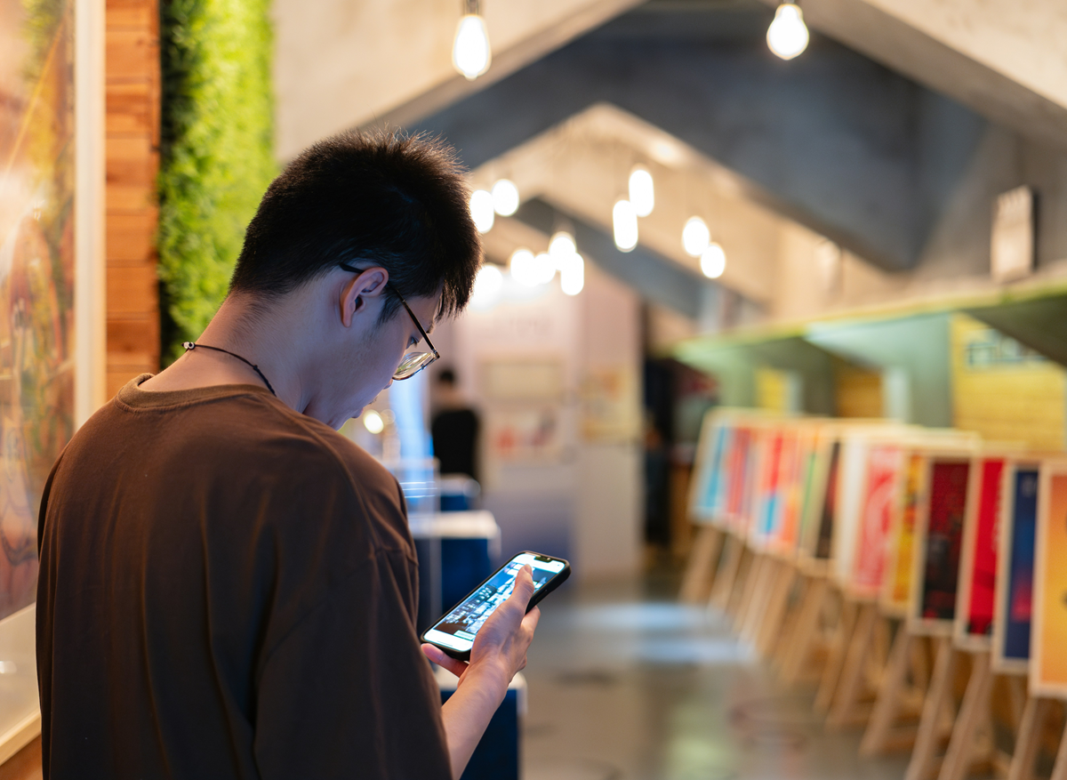 stock photo of a man looking at a phone