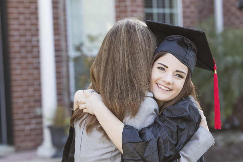 stock photo of a young person dressed for graduation